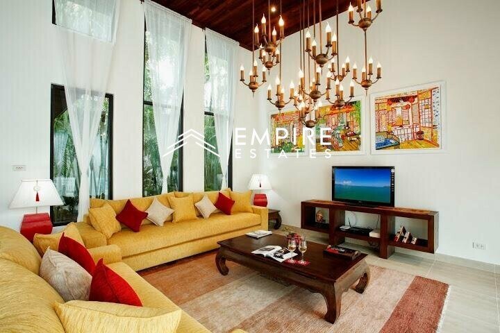 living room with large open window area and ceiling lights
