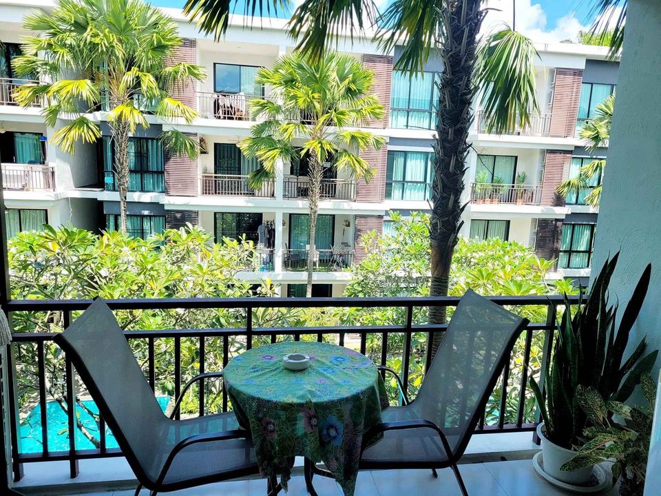 a table on the balcony in a resort setting